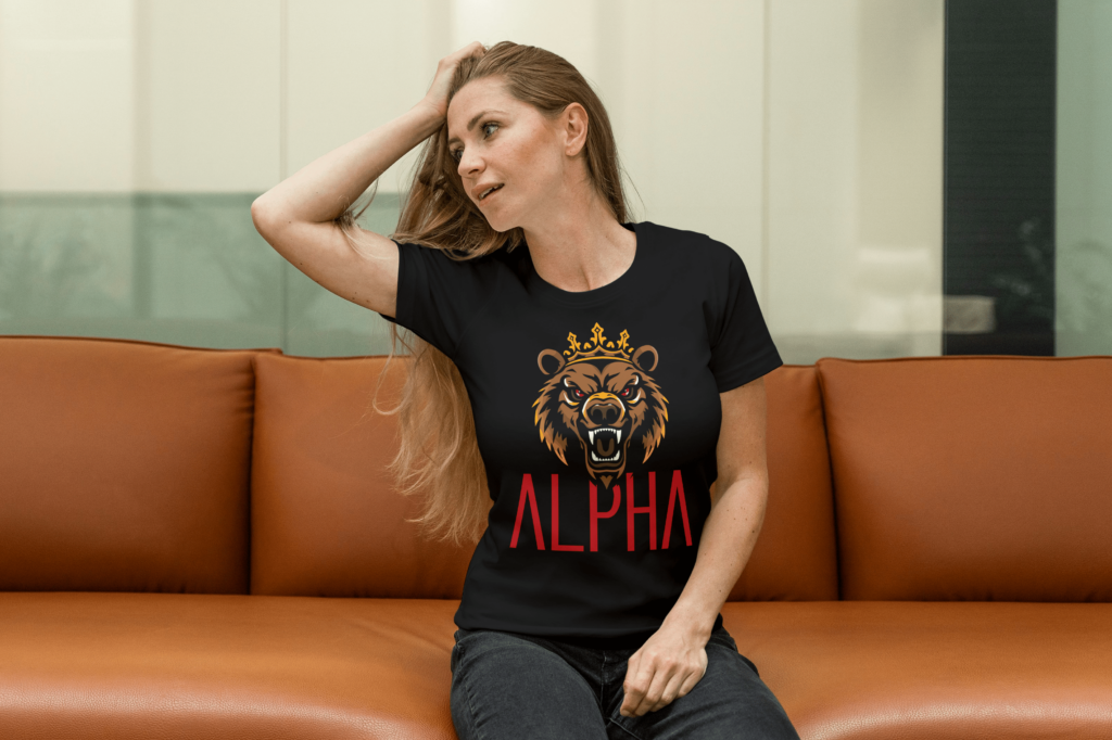 Attractive female wearing black Alpha shirt with grizzly bear face and bold red font.